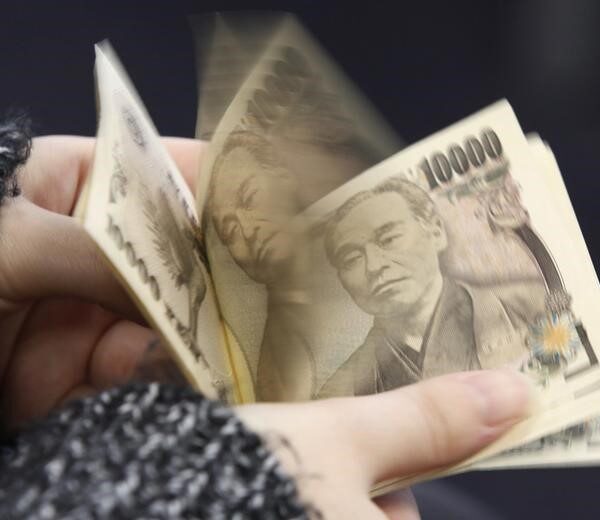 Japanese yen slides past key 155 level after BOJ holds rates steady