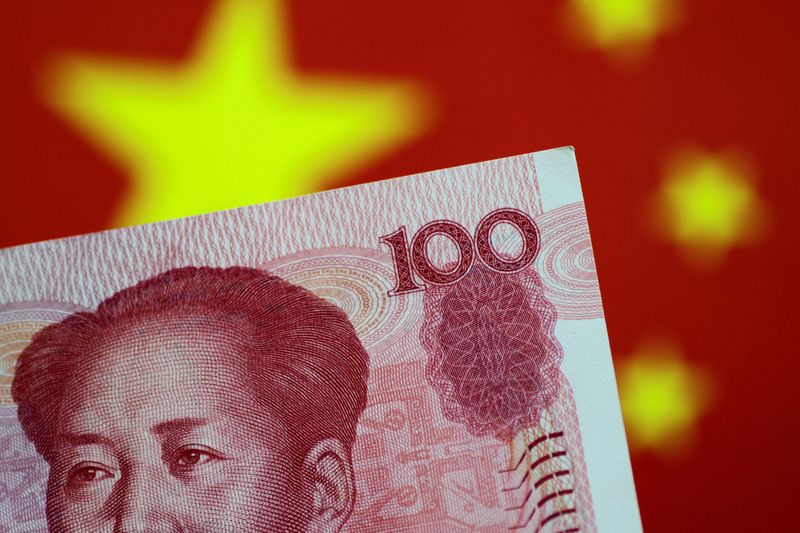 © Reuters. FILE PHOTO: A China yuan note is seen in this illustration photo May 31, 2017. REUTERS/Thomas White/Illustration/File Photo