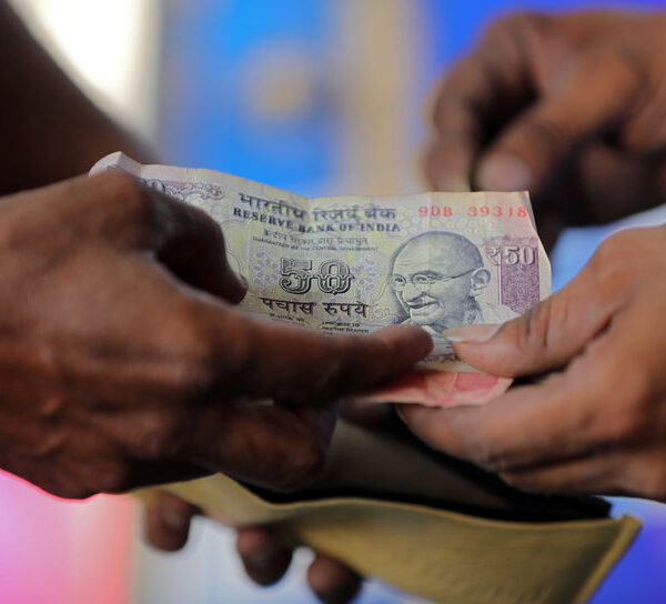 Asia FX edges lower as dollar remains near 2-yr high, Indian rupee hits record low